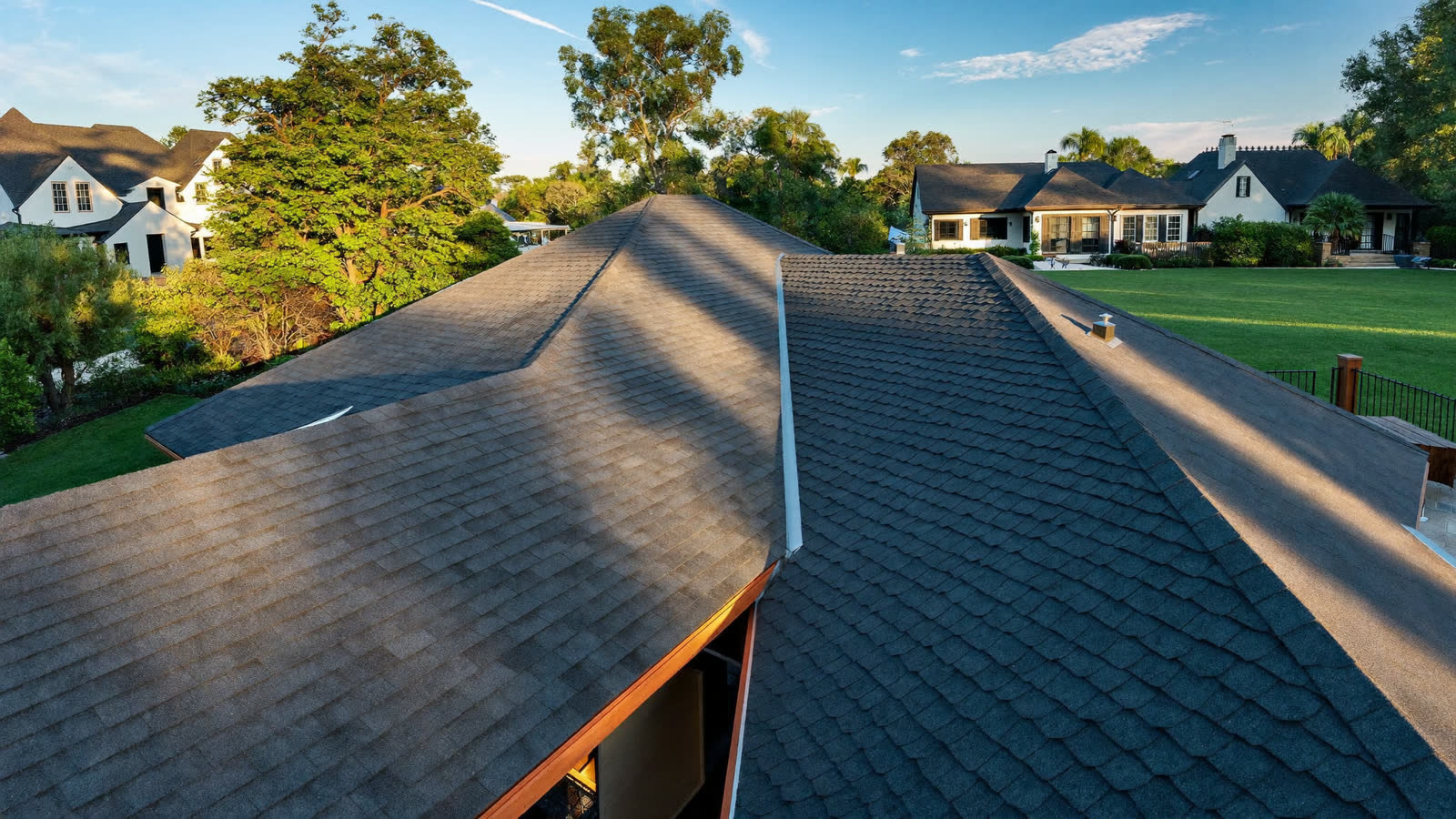 Completed architectural shingle roof in warm afternoon light in Chesterfield