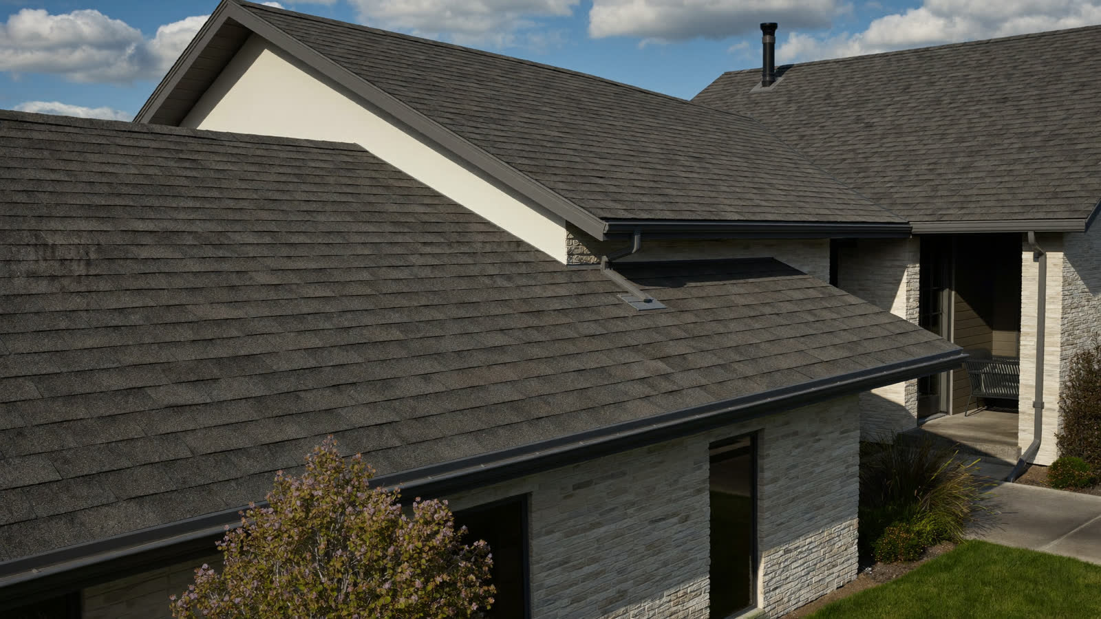 Completed architectural shingle roof on a ranch home in Manchester